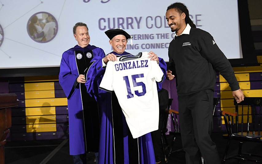 President Gonzalez receives customized soccer jersey on stage