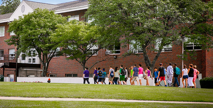 Students and parents take a tour of the Curry College campus