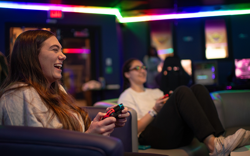 Students hang out and play games in the Esports Lounge