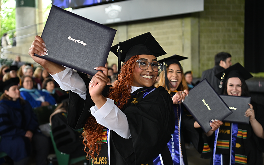 Curry College graduates celebrate at the Xfinity Center