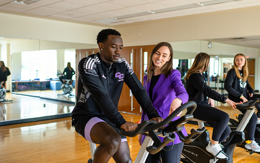 Courtney James leads a discussion in the fitness center