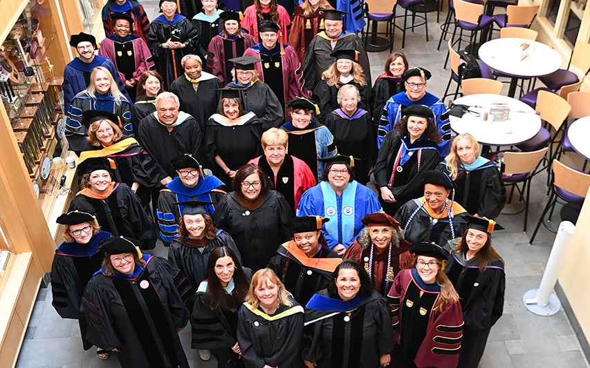 Faculty group photo in regalia 