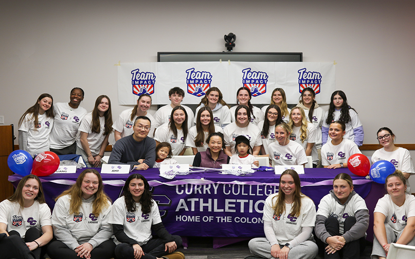 CC poses with the Women's LAX team