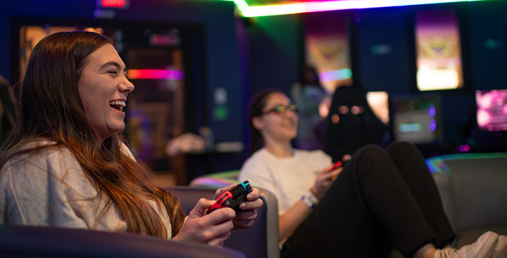 Students playing video games in the Esports lounge