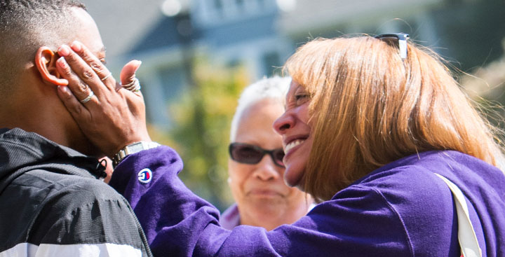 Curry College parent hugs her son