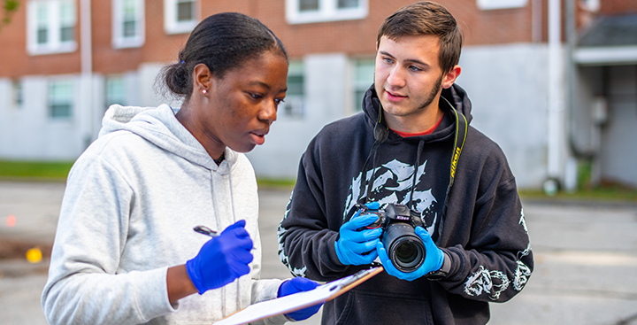 Curry College students analyze a crime scene in a forensic science class