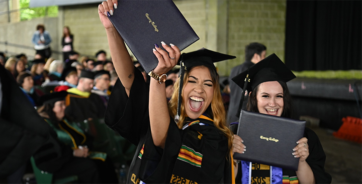 Curry College students proudly display their diplomas at Commencement