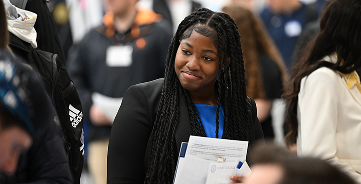 A students explores a Curry College job fair