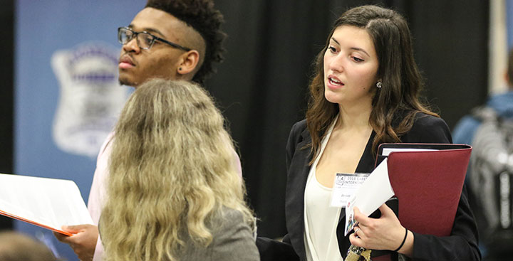 A student attends an internship and career fair