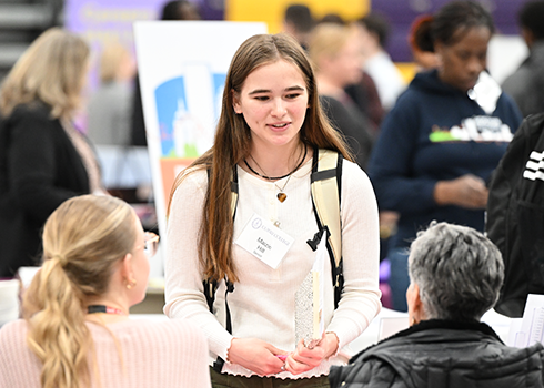 A student meets with an employer at Career fair