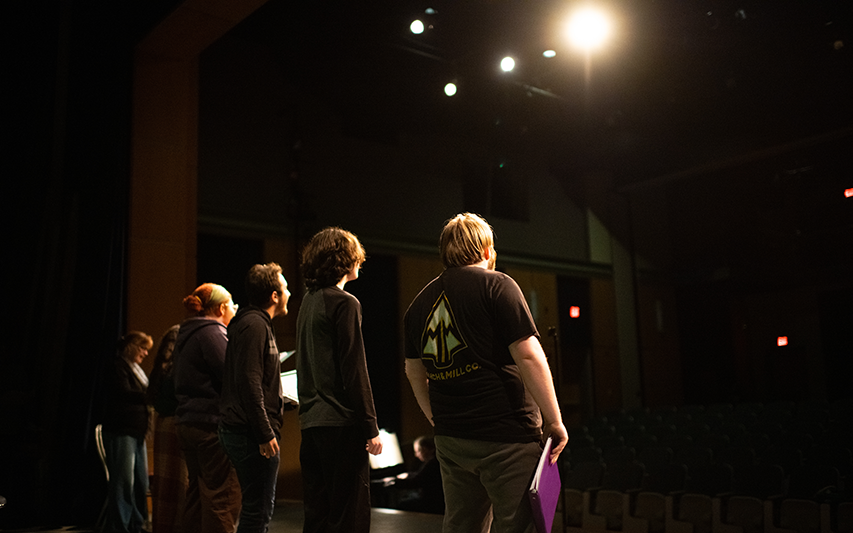 Curry College students on stage in the Keith Auditorium at Curry College, pursuing a Theatre minor or concentration