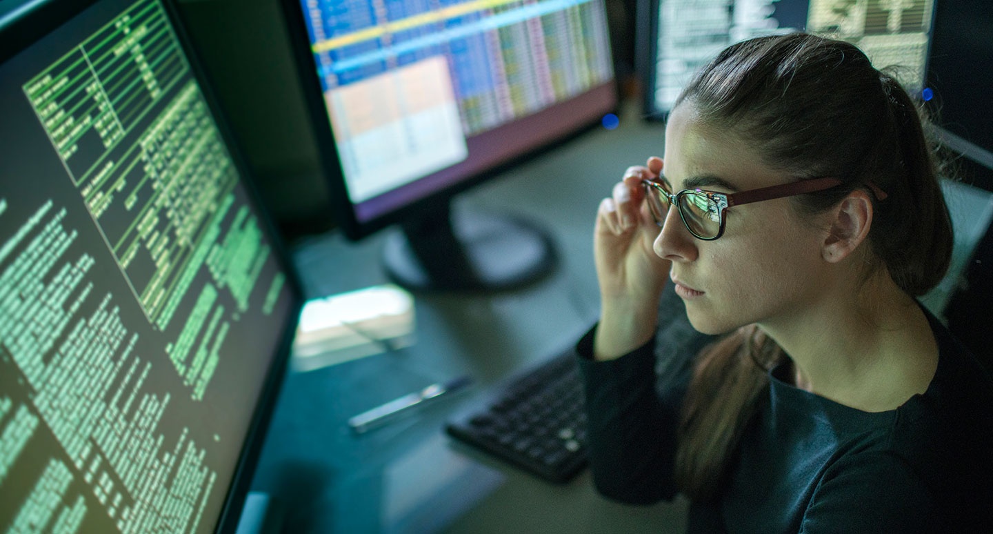 Cybercrime minor represented by a student researching on her computer