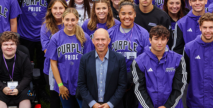Curry College President Jay Gonzalez and Curry College students pose for the class photo