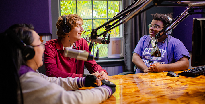 Students do a podcast at WMLN studios at Curry College