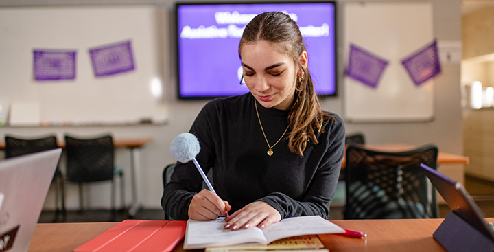 A PAL student works in the Assistive Technology Center