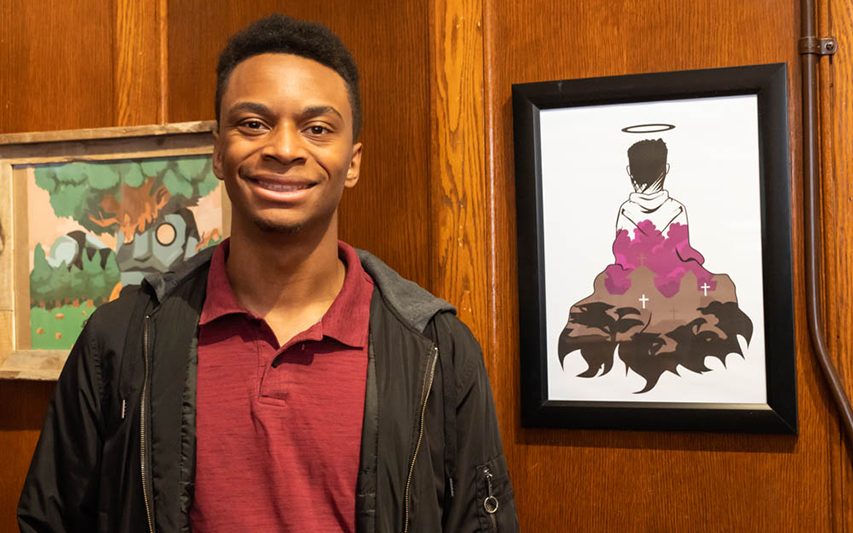 Curry College student presents his art work at the Menino Arts Center in Hyde Park