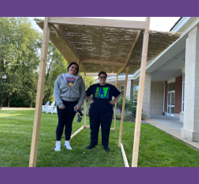 Rose ‘25, and Shahar ‘25 building the sukkah in front of the Stu